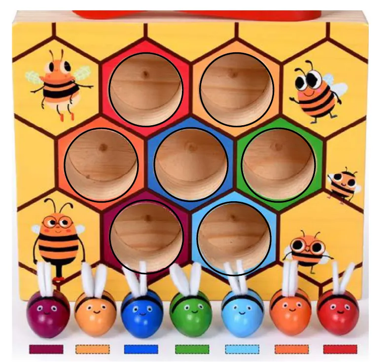 A yellow wooden toy block with seven round hollows on the top arranged like a honeycomb, with colourful bees below it.