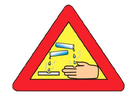 A red triangular warning sign showing a liquid dripping from a tilted test tube onto a hand, the sign for a corrosive substance.